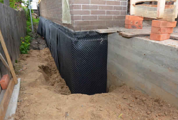 SJ Waterproofing Pros technician performing targeted Emergency Waterproofing assessment in Sidney, OH